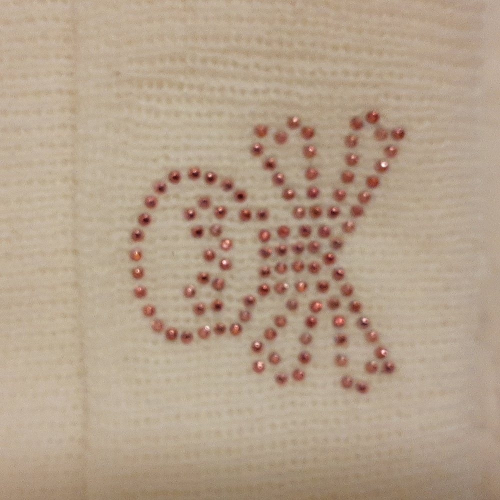 White toque with pink sparkly skull
